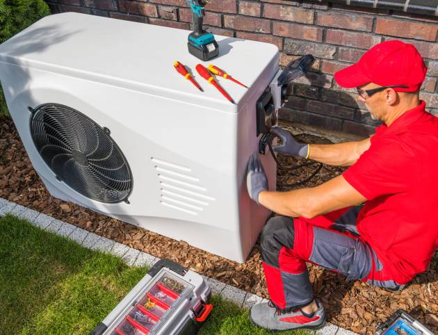 technician-repairing-heat-pump-unit-2025-03-13-13-36-27-utc